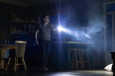 Patrick Heusinger as James in Paranormal Activity at Chicago Shakespeare Theater. This original story set in the world of the iconic film series runs October 8-November 2, 2025, in The Yard.