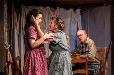 Ma (TimeLine Company Member Mechelle Moe, center) tries to make her daughter Sunny (Angela Morris, left) and husband Pa (TimeLine Company Member David Parkes, right) understand the importance of her mysterious visions in TimeLine Theatre’s world premiere of Black Sunday, Dolores Díaz’s haunting story of climate change, migration, and family in the days leading up to an infamous dust storm in 1930s Texas, directed by Helen Young.