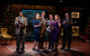 (left to right) Manny Buckley, Audrey Billings, Brandon Dahlquist, Ian Paul Custer, Dara Cameron, Joe Dempsey in American Blues Theater's 'It's A Wonderful Life: Live in Chicago!'