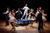 Tyler Johnson-Campion and Kelly Felthous (center) surrounded by ensemble in 'White Christmas' at Marriott Theatre