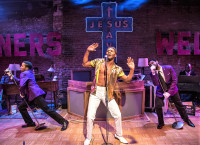 Gilbery Domally is center stage as Marty Joe with Breon Arzell (right) and Michael Turrentine in The Total bent at Den Theatre