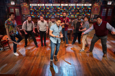 RJ Griffith (center) and the cast of The Choir of Man at Apollo Theater.