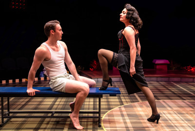 Andrew Alstat as Joe Hardy and Michelle Aravena as Lola in “Damn Yankees” at Marriott Theatre in Lincolnshire, IL.